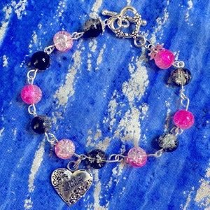 Bracelet. Pink, black and white.